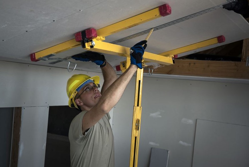 Man working on a drywall lift